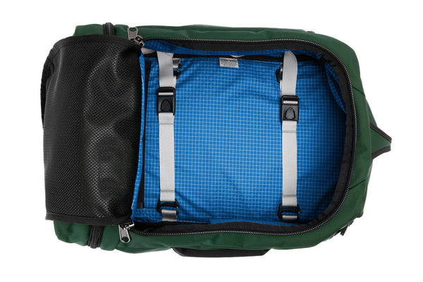 A Techonaut 30 with a Wilderness (dark green) exterior with Island (bright blue with white grid pattern) 200 Halcyon interior.